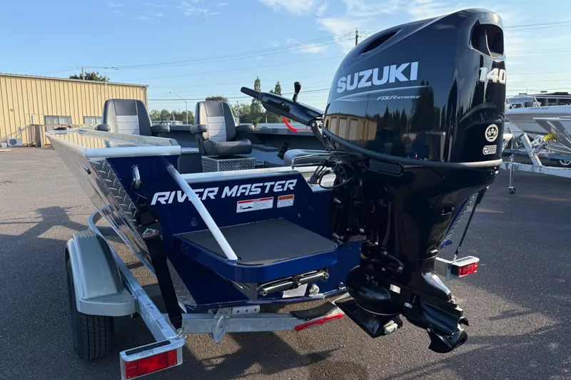 Slide: The Image of 2026 Fish Rite River Master 18 boat with Suzuki 140 outboard motor on trailer. - 5