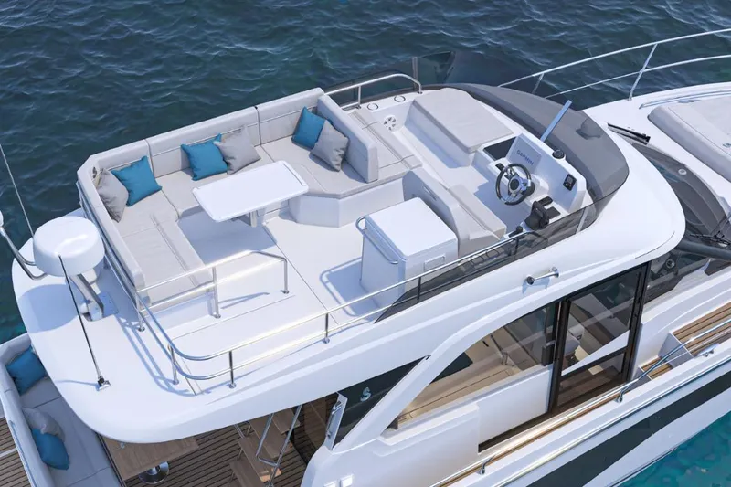 Slide: The Image of 2026 Beneteau Antares 12 Fly OB yacht with spacious flybridge and seating area. - 4