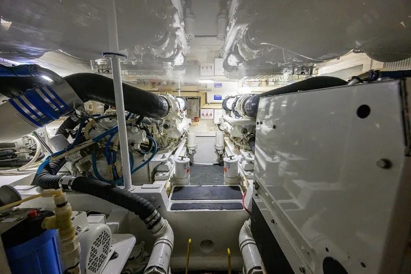 Slide: The Image of Engine room of 2004 Viking 48 Convertible yacht, showcasing machinery and components. - 15