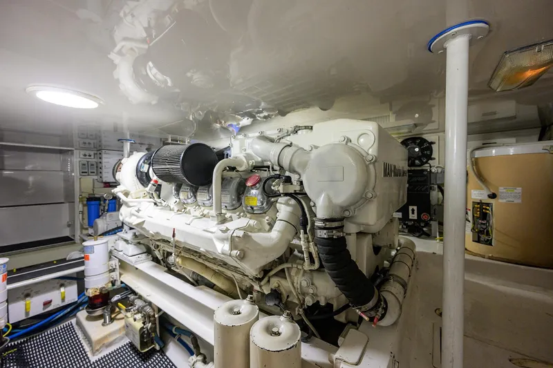 Slide: The Image of Engine room of 2004 Viking 48 Convertible yacht, showcasing a powerful marine engine. - 19