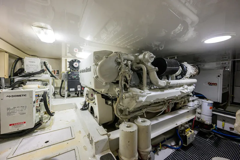 Slide: The Image of Engine room of a 2004 Viking 48 Convertible yacht, featuring a powerful diesel engine. - 20