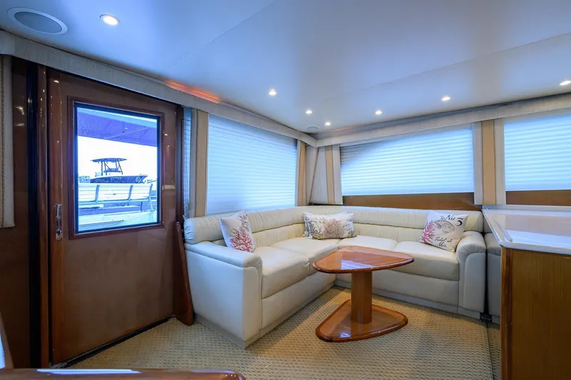 Slide: The Image of Luxurious interior of 2004 Viking 48 Convertible yacht with plush seating and elegant decor. - 26