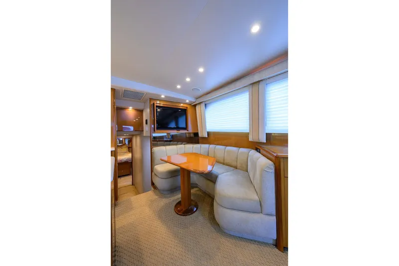 Slide: The Image of Luxurious interior of 2004 Viking 48 Convertible yacht with plush seating and modern amenities. - 27