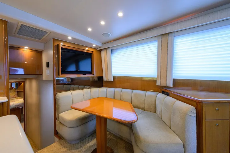 Slide: The Image of Luxurious interior of 2004 Viking 48 Convertible yacht with plush seating and modern amenities. - 29