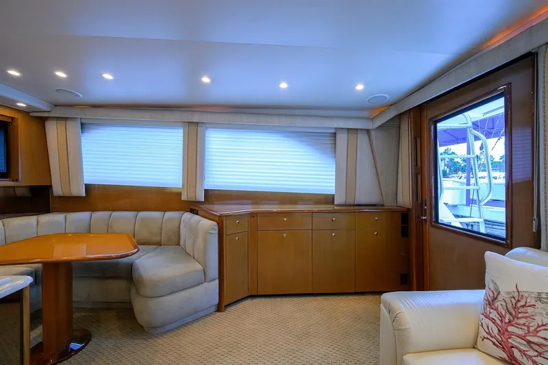 Slide: The Image of Luxurious interior of 2004 Viking 48 Convertible yacht with plush seating and elegant wood finishes. - 30
