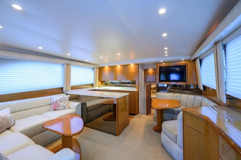Slide: The Image of Luxurious interior of 2004 Viking 48 Convertible yacht with elegant seating and modern amenities. - 34