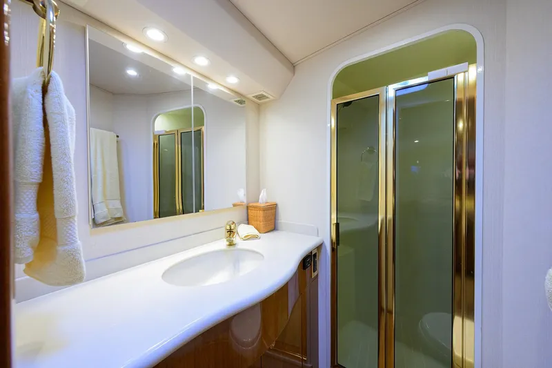 Slide: The Image of Luxurious bathroom in 2004 Viking 48 Convertible yacht with elegant fixtures and spacious shower. - 43