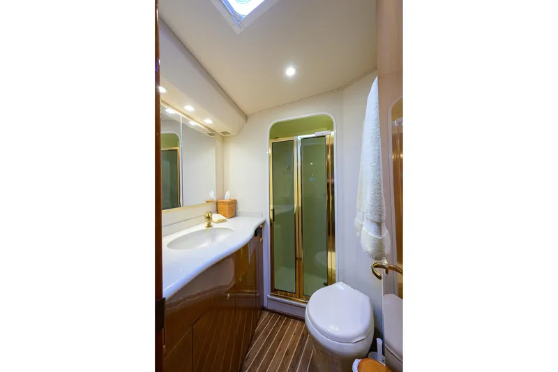 Slide: The Image of Luxurious bathroom in 2004 Viking 48 Convertible yacht with shower and elegant fixtures. - 45