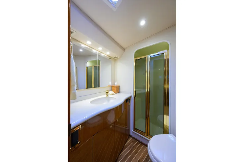 Slide: The Image of Luxurious bathroom in 2004 Viking 48 Convertible yacht with shower and elegant fixtures. - 51