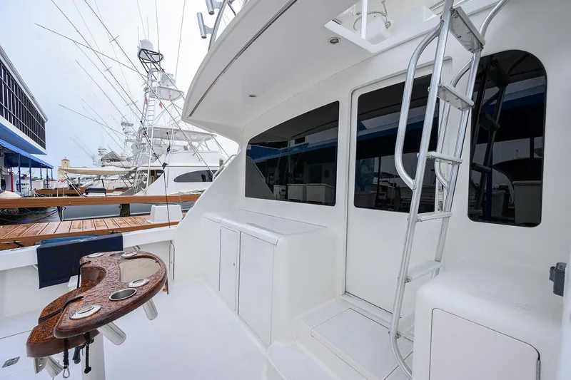 Slide: The Image of 2004 Viking 48 Convertible yacht deck with ladder and fishing station. - 65