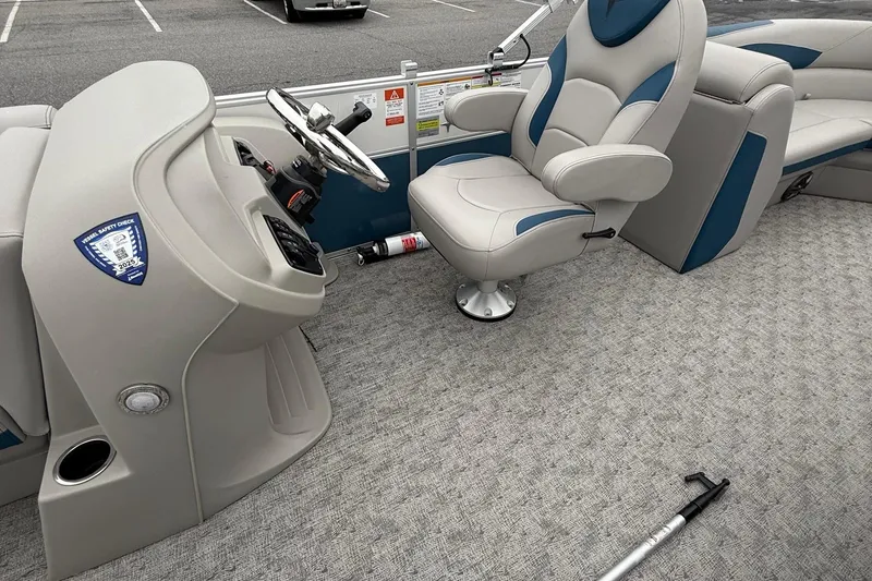 Slide: The Image of 2025 Berkshire 24RFX LE 2.75 boat interior with steering console and captain's chair. - 22