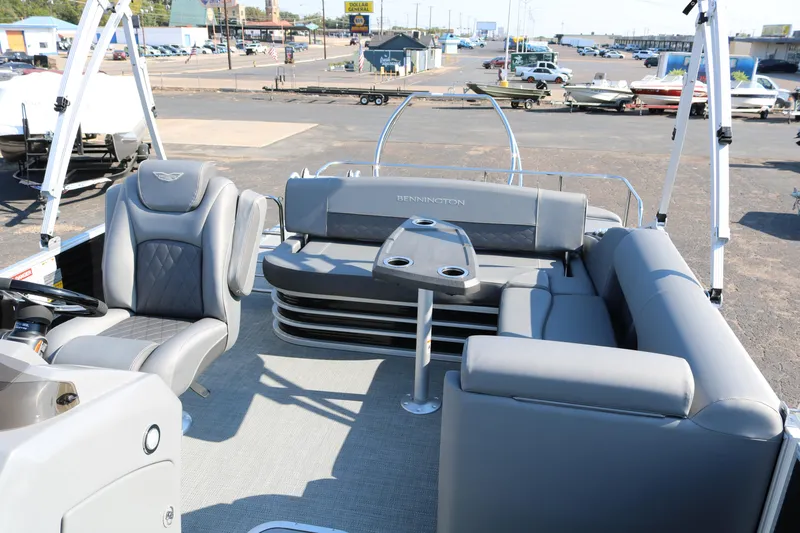 Slide: The Image of 2025 Bennington 22 LSWING BACK pontoon boat with gray seating and table. - 11