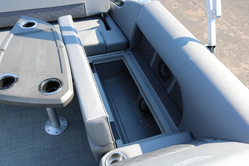 Slide: The Image of 2025 Bennington 22 LSWING BACK boat interior with storage and seating. - 27