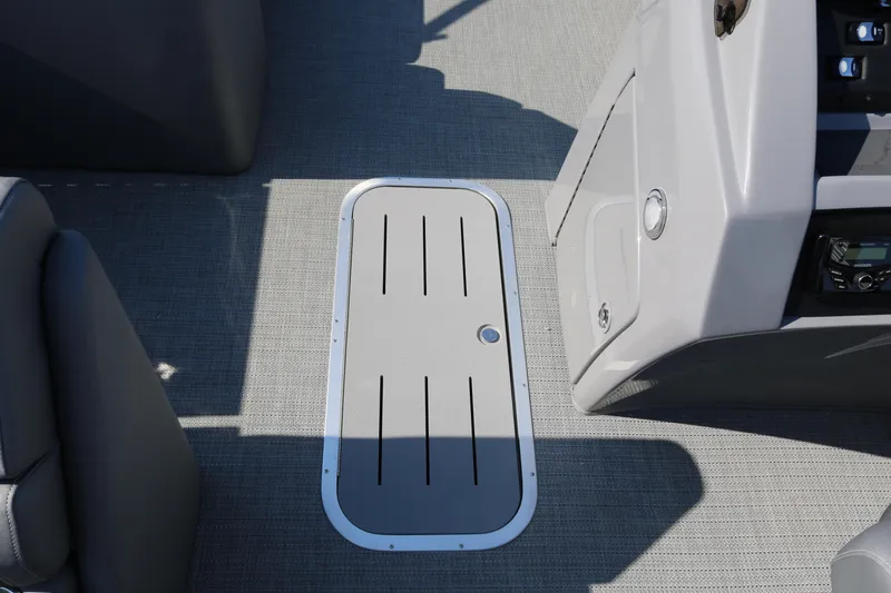 Slide: The Image of 2025 Bennington 22 LSWING BACK boat interior with sleek flooring and control panel. - 31