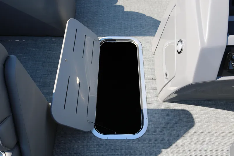 Slide: The Image of Open storage compartment on 2025 Bennington 22 LSWING BACK boat. - 32