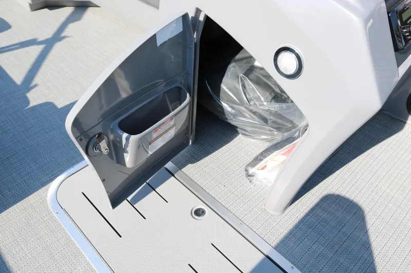 Slide: The Image of 2025 Bennington 22 LSWING BACK boat storage compartment with open door. - 33