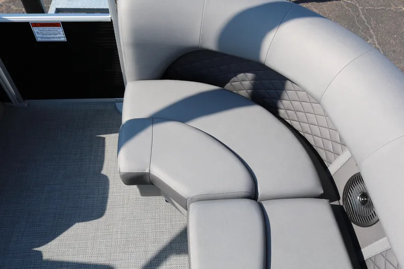Slide: The Image of 2025 Bennington 22 LSWING BACK boat interior with gray cushioned seating. - 35