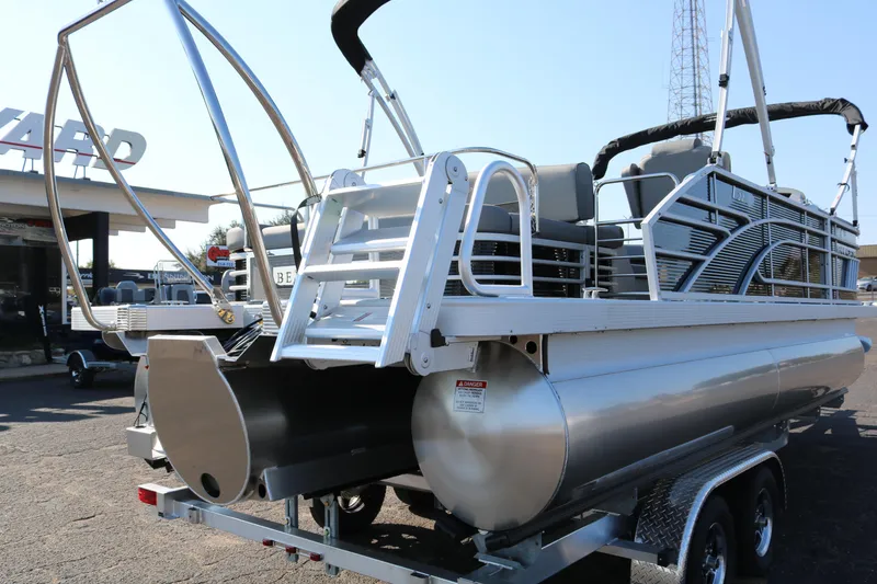 Slide: The Image of 2025 Bennington 22 LSWING BACK pontoon boat, rear view with ladder and seating. - 8