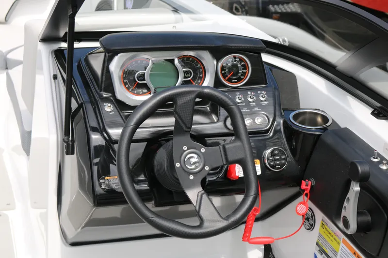 Slide: The Image of Dashboard of 2026 Scarab 215 SE boat with steering wheel and gauges. - 10