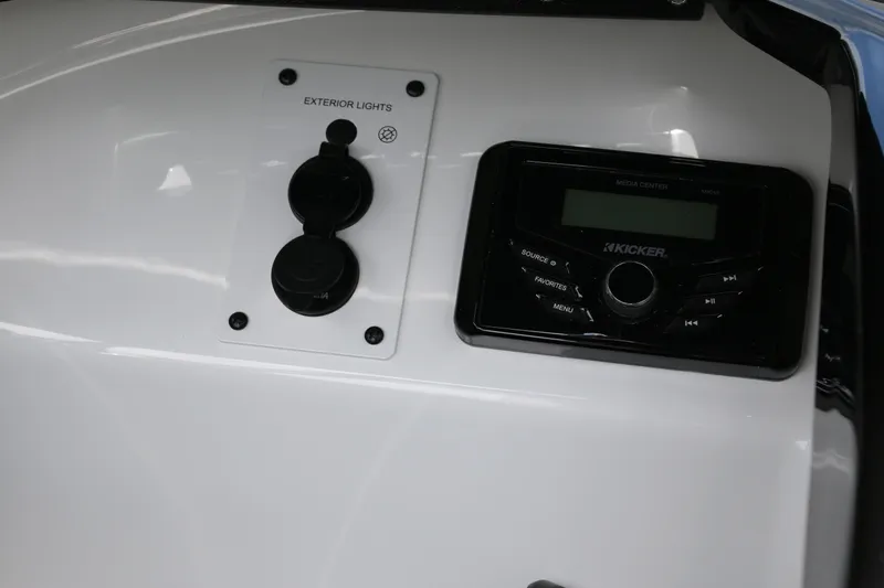 Slide: The Image of Control panel of 2026 Scarab 215 SE boat with exterior lights and audio system. - 12