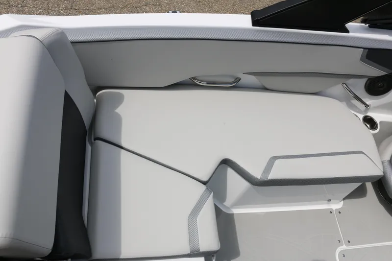 Slide: The Image of 2026 Scarab 215 SE boat interior seating with sleek, modern design and comfortable upholstery. - 16