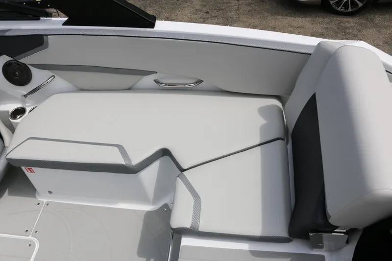 Slide: The Image of 2026 Scarab 215 SE boat interior with sleek white seating and modern design. - 17