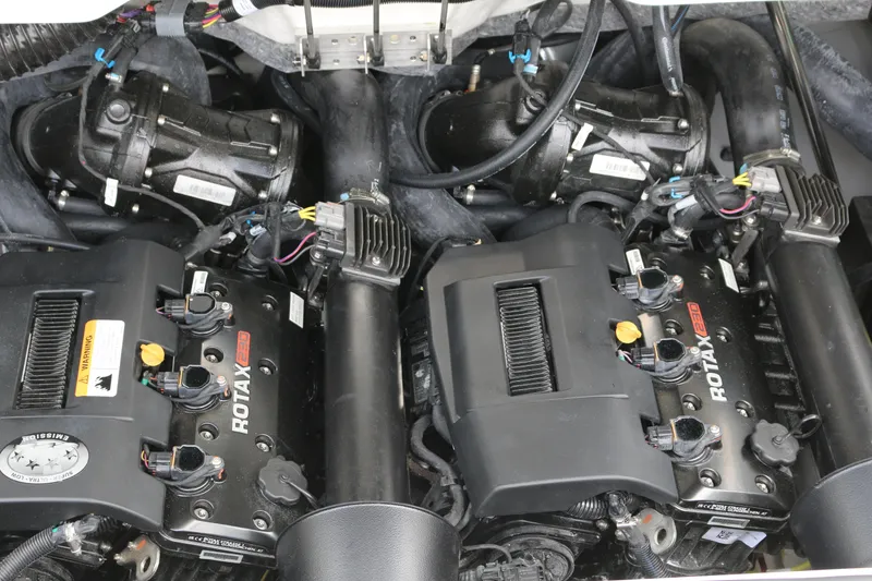 Slide: The Image of Engine compartment of 2026 Scarab 215 SE with dual Rotax engines. - 18