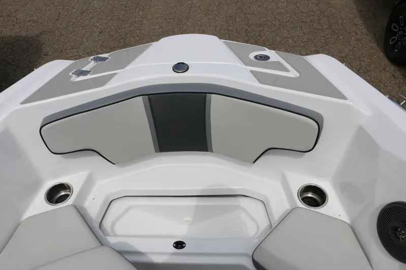 Slide: The Image of 2026 Scarab 215 SE boat interior with gray and white seating and cup holders. - 6