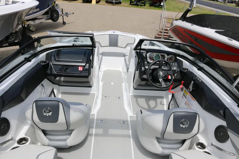 Slide: The Image of 2026 Scarab 215 SE boat interior with modern dashboard and seating. - 9