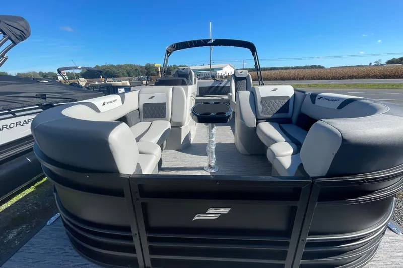 Slide: The Image of 2026 Starcraft SLS 3 Q DH pontoon boat on display outdoors. - 10