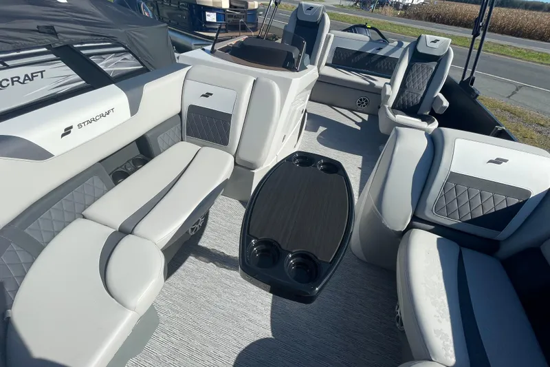 Slide: The Image of Luxurious interior of 2026 Starcraft SLS 3 Q DH boat with plush seating and table. - 11