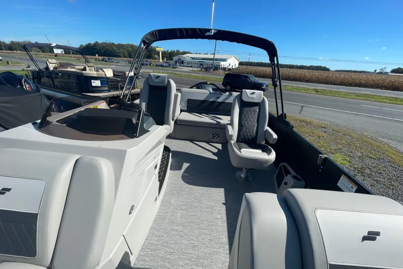 Slide: The Image of 2026 Starcraft SLS 3 Q DH boat interior with modern seating and sleek design. - 12