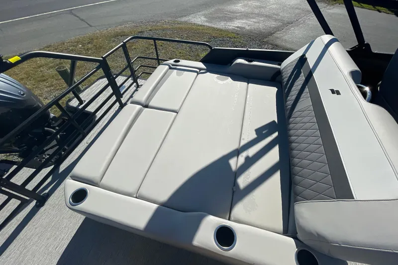 Slide: The Image of 2026 Starcraft SLS 3 Q DH boat interior with plush seating and cup holders. - 3