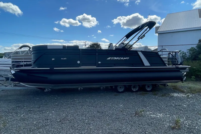 Slide: The Image of 2026 Starcraft SLS 3 Q DH boat cockpit with steering wheel and control panel. - 5