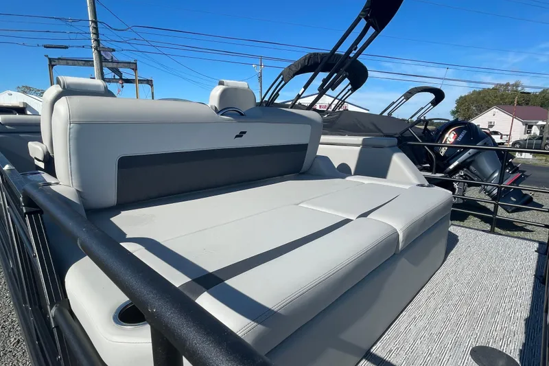 Slide: The Image of 2026 Starcraft SLS 3 Q DH pontoon boat with Mercury engine, displayed outdoors. - 7