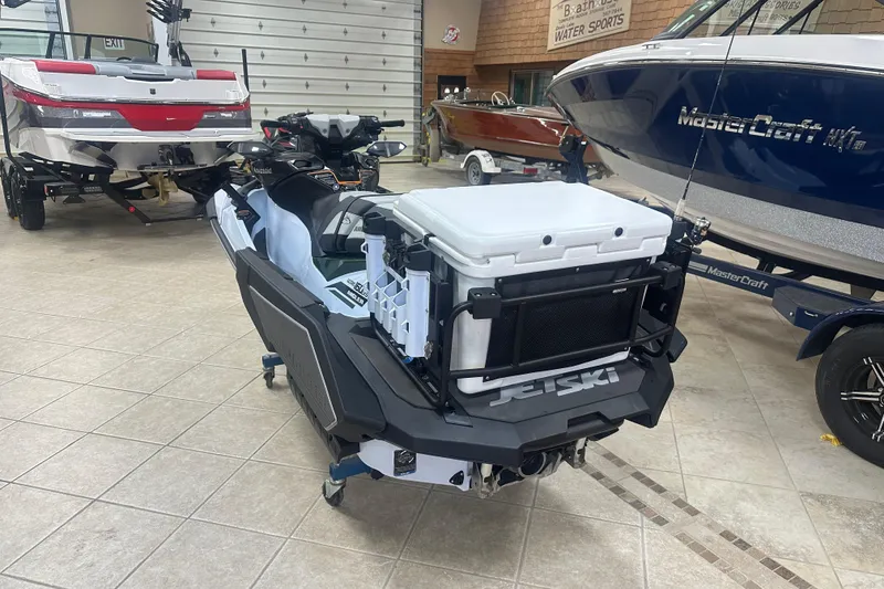 Slide: The Image of 2025 Kawasaki Ultra 160 LX-s Angler jet ski in showroom, equipped with fishing gear. - 3