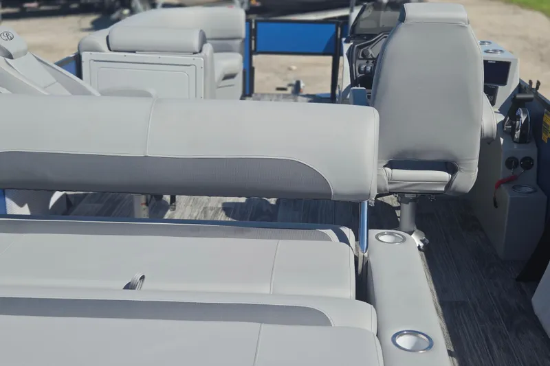 Slide: The Image of 2026 Bentley Pontoons 223 Swingback interior with gray seating and modern dashboard. - 11