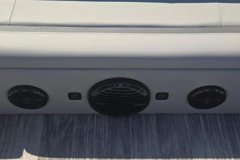 Slide: The Image of 2026 Bentley Pontoons 223 Swingback interior speakers on a sleek seating area. - 13
