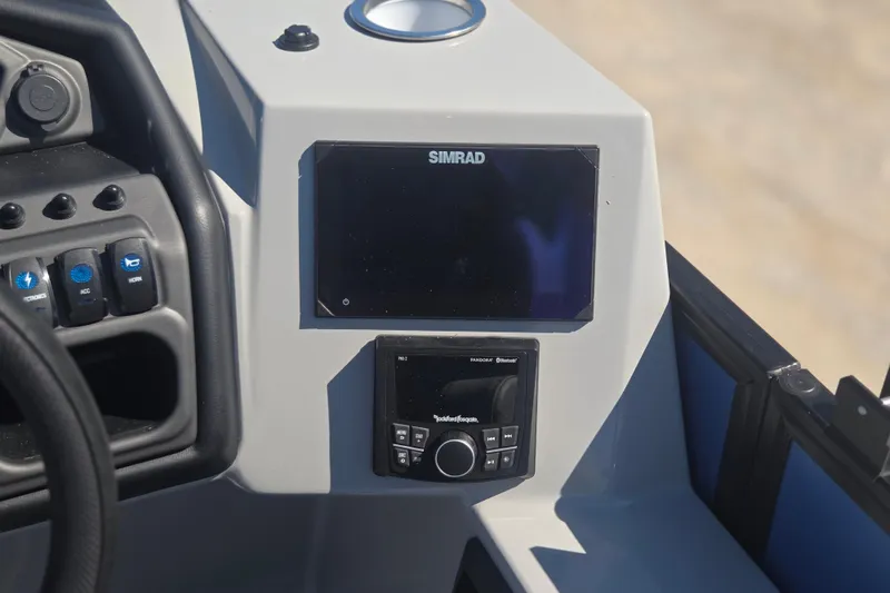 Slide: The Image of Dashboard of 2026 Bentley Pontoons 223 Swingback with Simrad display and controls. - 21