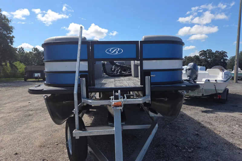 Slide: The Image of 2026 Bentley Pontoons 223 Swingback on trailer under blue sky. - 7
