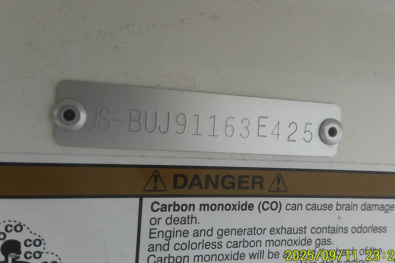 Slide: The Image of 2025 Mako Pro Skiff 17 CC hull identification number and carbon monoxide warning label. - 21