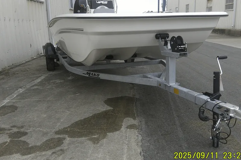 Slide: The Image of 2025 Mako Pro Skiff 17 CC boat on trailer, parked outdoors. - 27