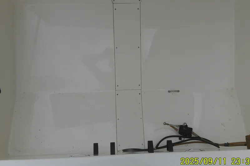 Slide: The Image of Interior view of a 2025 Mako Pro Skiff 17 CC boat hull. - 8