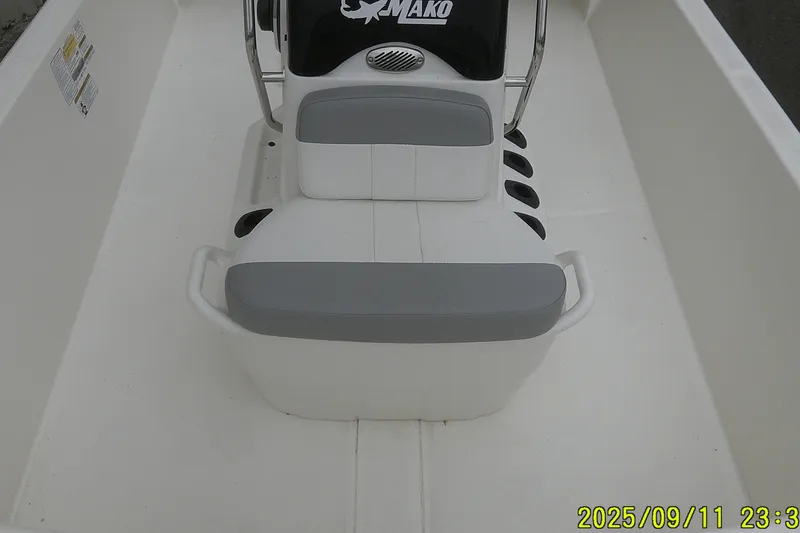 Slide: The Image of 2025 Mako Pro Skiff 17 CC boat interior with seating and console. - 9