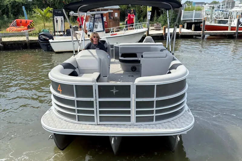 Slide: The Image of 2025 Berkshire 24RFC LE 2.75 pontoon boat for sale in parking lot. - 3