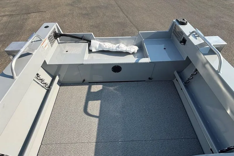 Slide: The Image of 2025 Hewescraft 180 Sportsman boat interior with spacious deck and storage compartments. - 8