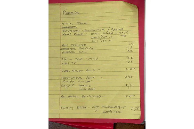 Slide: The Image of Handwritten maintenance list for 2004 Beneteau Oceanis 473 yacht on yellow notepad. - 107