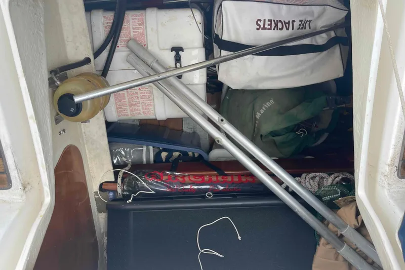 Slide: The Image of Storage compartment of a 2004 Beneteau Oceanis 473 sailboat with life jackets and equipment. - 26