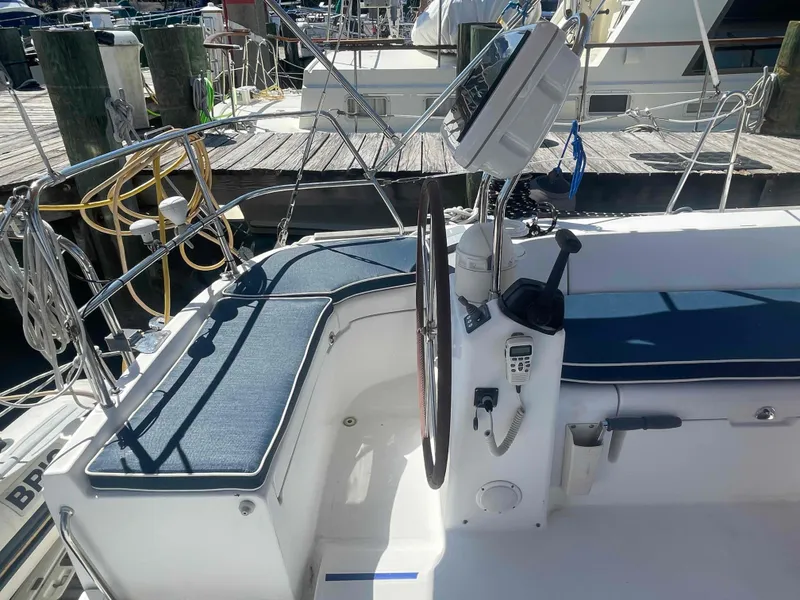 Slide: The Image of Cockpit of 2004 Beneteau Oceanis 473 sailboat with steering wheel and navigation equipment. - 40