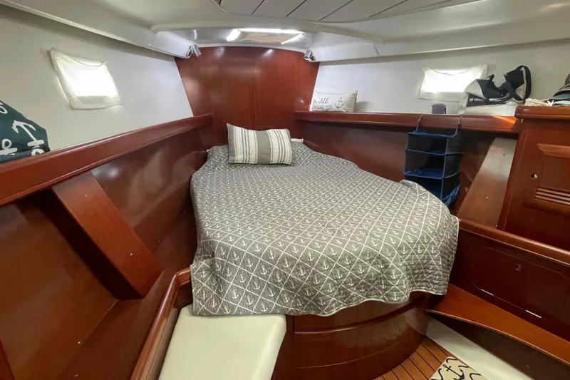 Slide: The Image of Luxurious cabin interior of 2004 Beneteau Oceanis 473 sailboat with cozy bed and wooden finish. - 7